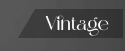 The Vintage badge, a dark angled tab with Vintage set in the logo serif